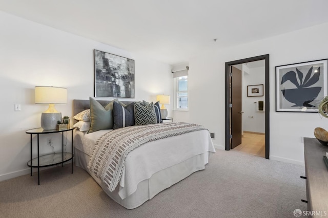 bedroom with light colored carpet