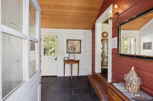 foyer entrance featuring wooden ceiling and vaulted ceiling