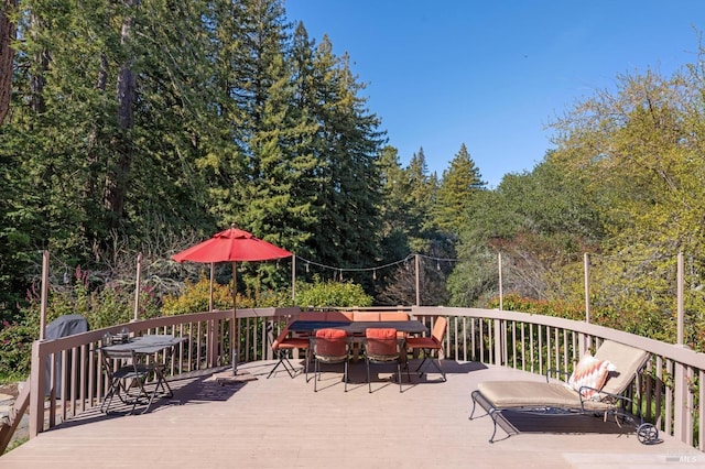 deck featuring outdoor dining area