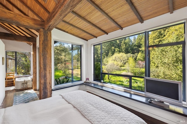 unfurnished bedroom featuring multiple windows, vaulted ceiling with beams, wooden ceiling, and wood finished floors