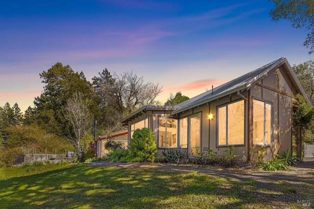 view of home's exterior featuring a lawn