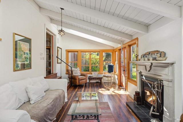 living room featuring vaulted ceiling with beams, stairs, dark wood-type flooring, a tile fireplace, and wooden ceiling