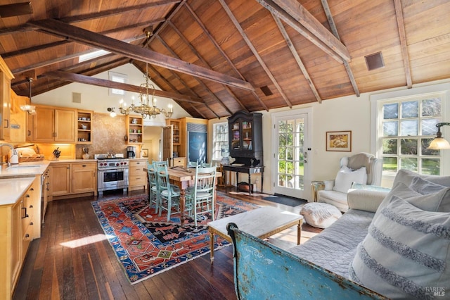 living room with beamed ceiling, high vaulted ceiling, dark wood finished floors, a chandelier, and wooden ceiling
