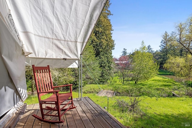 deck featuring a yard