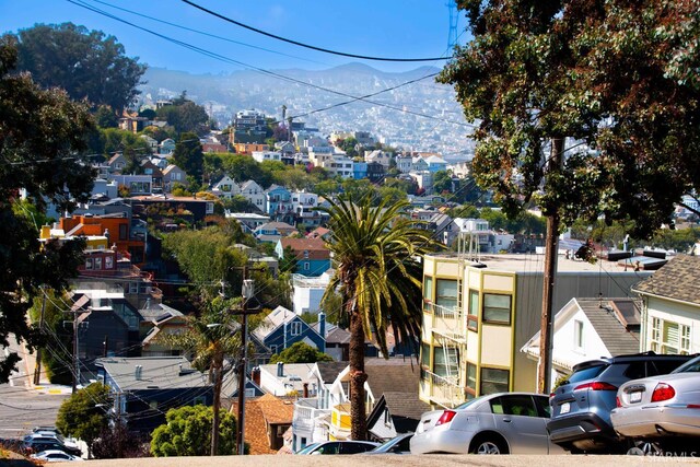 569 Peralta Ave, San Francisco, CA 94110 - aerial perspective of suburban area featuring a mountainous background