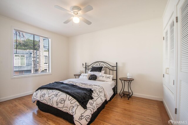 569 Peralta Ave, San Francisco, CA 94110 - bedroom featuring light wood-type flooring, baseboards, a ceiling fan, and crown molding