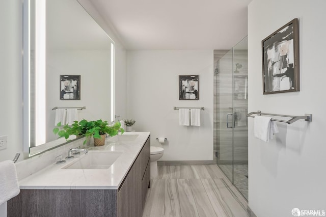 bathroom featuring walk in shower, vanity, and toilet