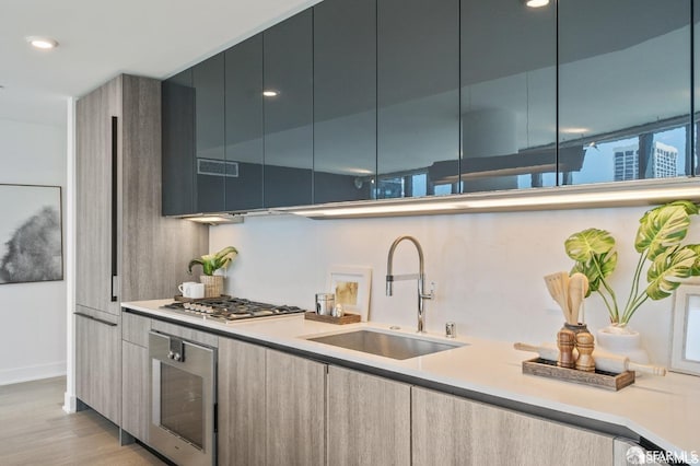 338 Main St Unit 35E, San Francisco, CA 94105 - kitchen with stainless steel gas cooktop, oven, a sink, and modern cabinets