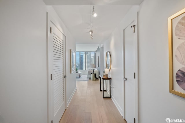 338 Main St Unit 35E, San Francisco, CA 94105 - hallway featuring baseboards and light wood-style floors