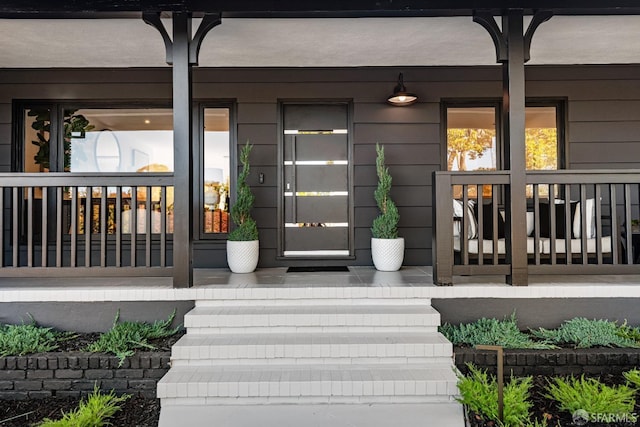 doorway to property featuring a porch