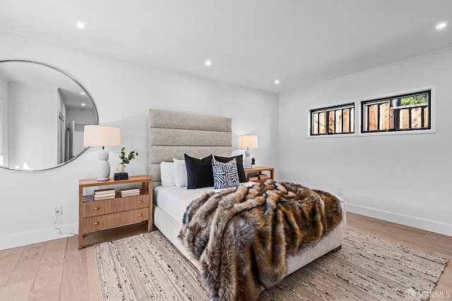 bedroom with light hardwood / wood-style floors