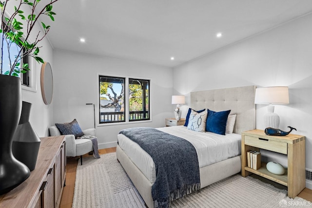 bedroom with light wood-type flooring