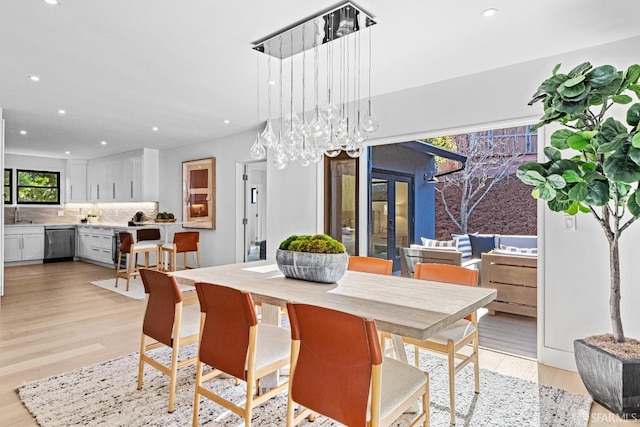 dining space featuring light wood-type flooring