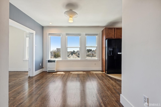 1375 Sacramento St, San Francisco, CA 94109 - unfurnished dining area featuring healthy amount of natural light, dark wood-style flooring, baseboards, and heating unit