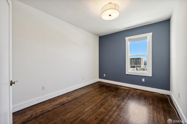 1375 Sacramento St, San Francisco, CA 94109 - spare room featuring baseboards and dark wood-style flooring