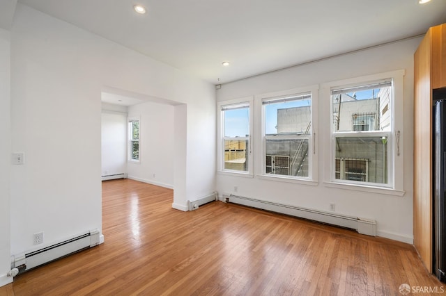 1375 Sacramento St, San Francisco, CA 94109 - unfurnished room featuring a baseboard heating unit, light wood-type flooring, and recessed lighting