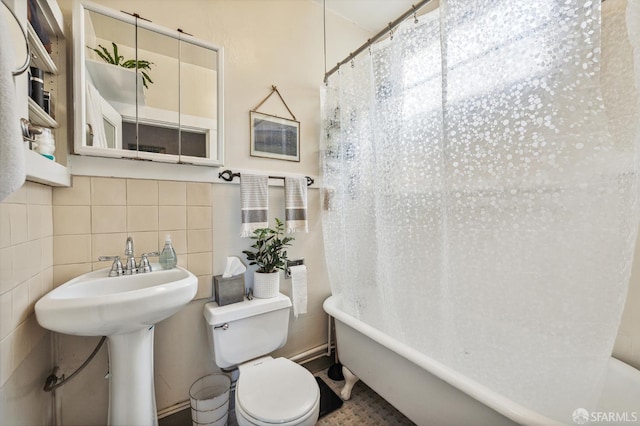 1375 Sacramento St, San Francisco, CA 94109 - bathroom featuring tile walls, toilet, shower / bath combination with curtain, and a sink