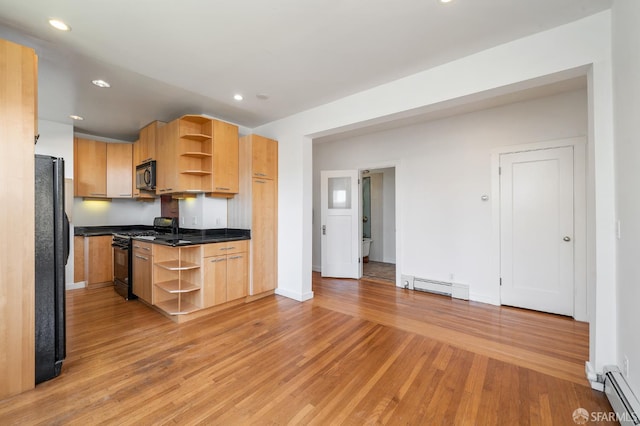 1375 Sacramento St, San Francisco, CA 94109 - kitchen with open shelves, black appliances, a baseboard radiator, and recessed lighting