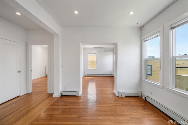 1375 Sacramento St, San Francisco, CA 94109 - spare room featuring baseboard heating, light wood-style flooring, a baseboard heating unit, and recessed lighting
