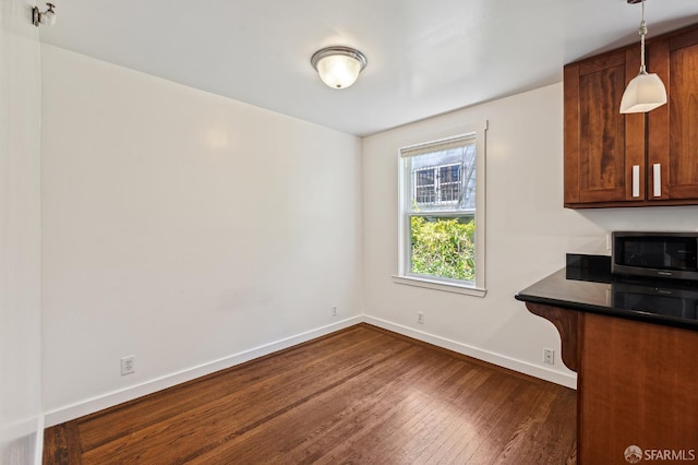 1375 Sacramento St, San Francisco, CA 94109 - unfurnished dining area featuring dark wood-style flooring and baseboards