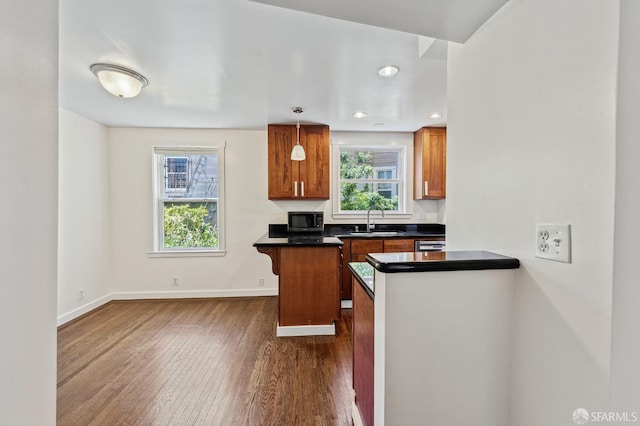 1375 Sacramento St, San Francisco, CA 94109 - kitchen featuring a sink, dark wood-type flooring, dark countertops, plenty of natural light, and recessed lighting