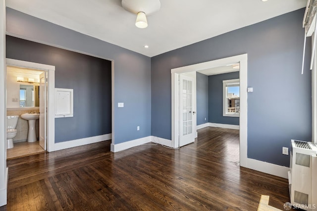 1375 Sacramento St, San Francisco, CA 94109 - spare room with wood finished floors, baseboards, heating unit, and a sink