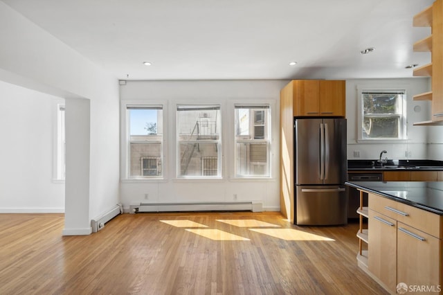 1375 Sacramento St, San Francisco, CA 94109 - kitchen featuring freestanding refrigerator, open shelves, a baseboard heating unit, dark countertops, and light wood-style floors