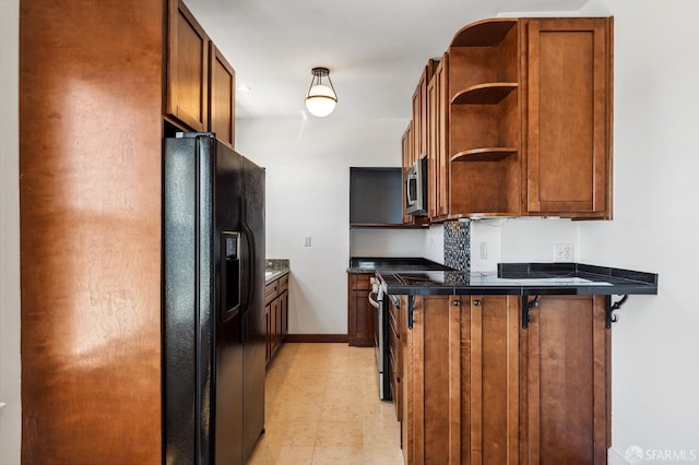 1375 Sacramento St, San Francisco, CA 94109 - kitchen with black fridge with ice dispenser, stainless steel microwave, a peninsula, open shelves, and dark countertops