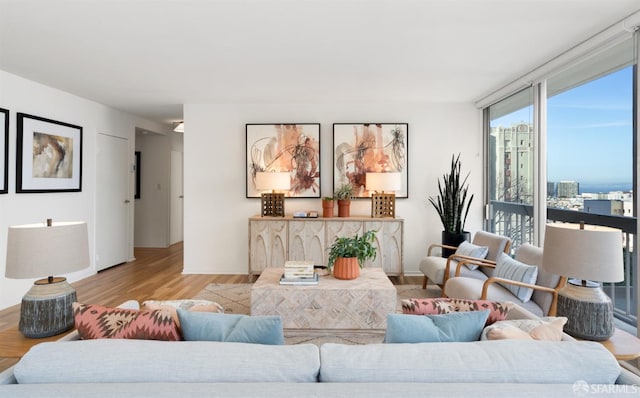 living area with wood finished floors and baseboards