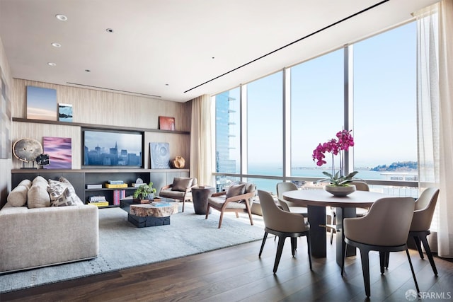 interior space featuring floor to ceiling windows, dark wood-style flooring, and recessed lighting