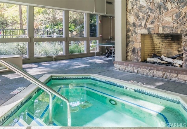 view of swimming pool with an indoor in ground hot tub