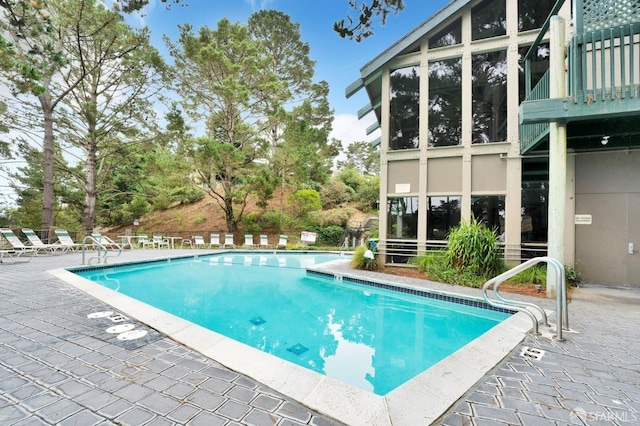 view of swimming pool with a patio