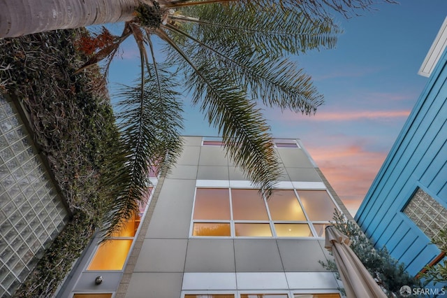 view of outdoor building at dusk