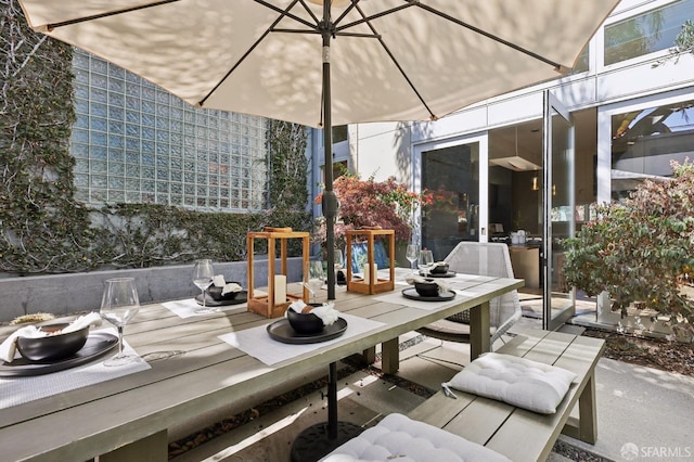 wooden terrace with a patio