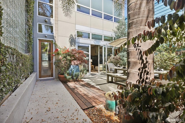 doorway to property featuring a patio