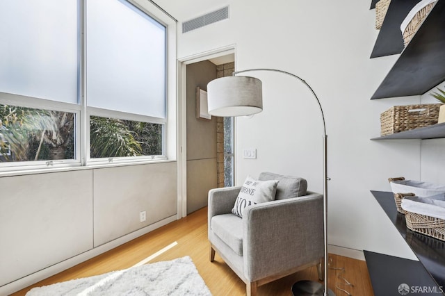 sitting room with light hardwood / wood-style flooring