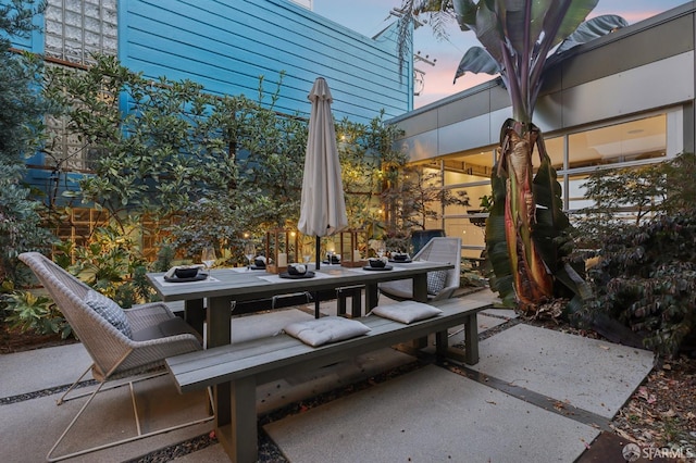 view of patio terrace at dusk