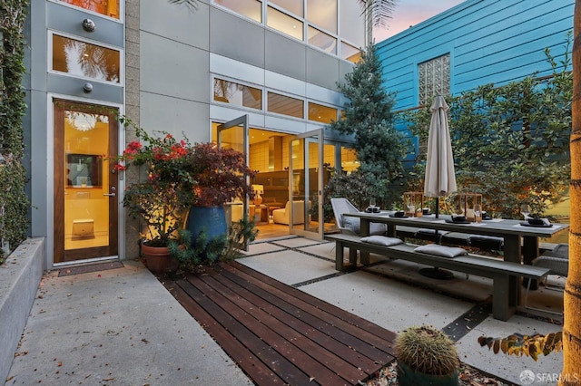 deck at dusk with a patio