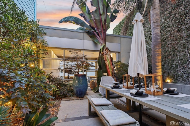 view of patio terrace at dusk