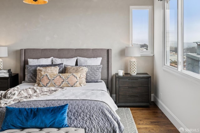 2266 Cecilia Ave, San Francisco, CA 94116 - bedroom featuring multiple windows and wood finished floors