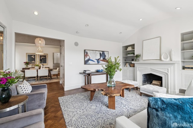 2266 Cecilia Ave, San Francisco, CA 94116 - living room with built in shelves, lofted ceiling, a fireplace, and recessed lighting