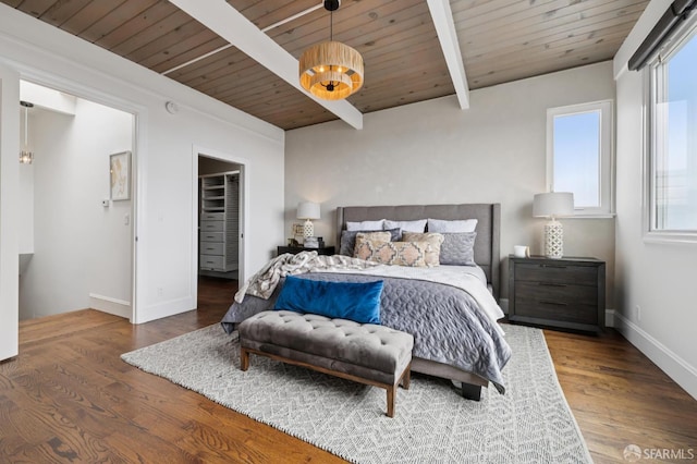 2266 Cecilia Ave, San Francisco, CA 94116 - bedroom with a wood ceiling with exposed beams, multiple windows, wood finished floors, and a spacious closet