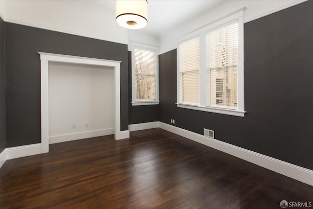 245 Scott St, San Francisco, CA 94117 - unfurnished dining area featuring wood finished floors, baseboards, and visible vents