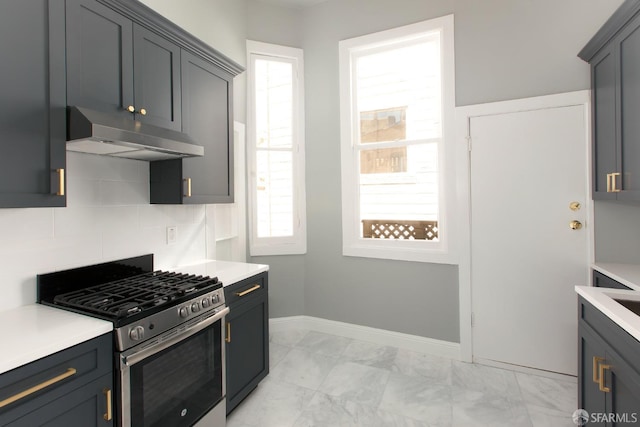 245 Scott St, San Francisco, CA 94117 - kitchen featuring light countertops, plenty of natural light, stainless steel range with gas cooktop, and under cabinet range hood