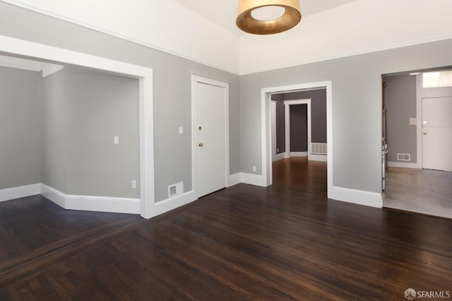 245 Scott St, San Francisco, CA 94117 - spare room with dark wood-style flooring, baseboards, and visible vents