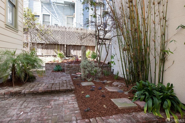 245 Scott St, San Francisco, CA 94117 - view of yard featuring fence and a patio