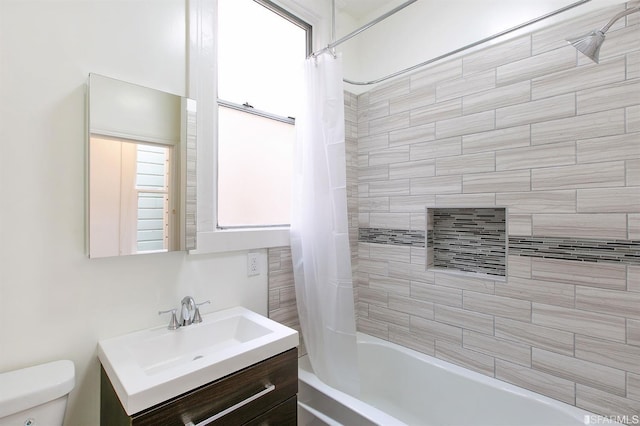 full bathroom with vanity, shower / bathtub combination with curtain, and toilet