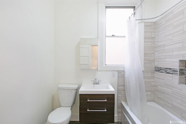 full bathroom featuring vanity, toilet, and shower / tub combo