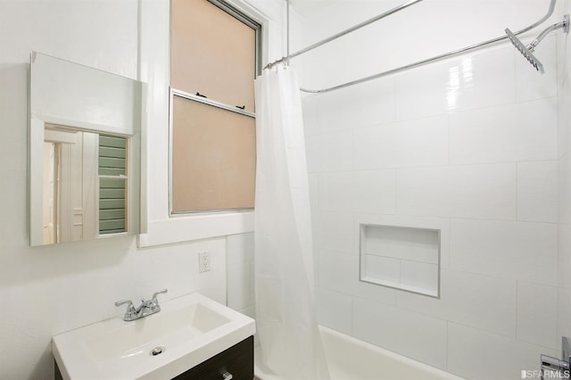 bathroom featuring shower / tub combo with curtain and vanity