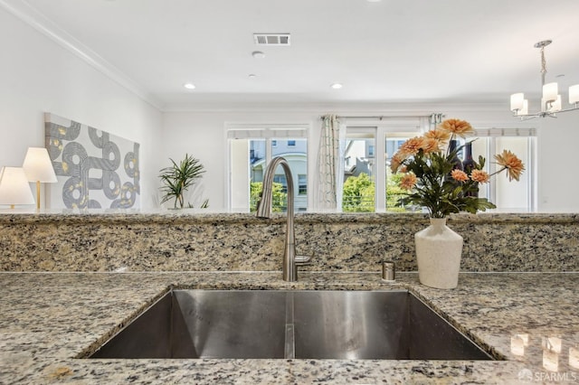 176 Summit Way, San Francisco, CA 94132 - kitchen view of a sink, stone countertops, a chandelier, ornamental molding, and hanging light fixtures